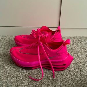 Hot pink Nike running shoes